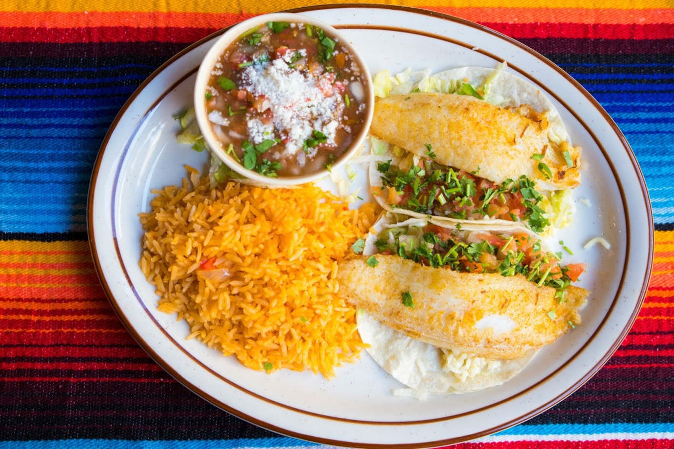 Rice, grilled fish and salad on the side